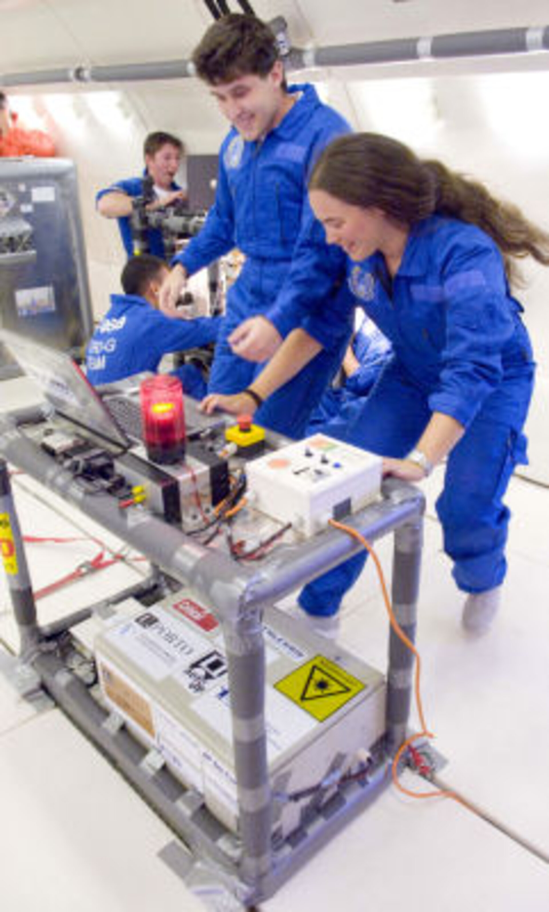Students performing an experiment in Zero G