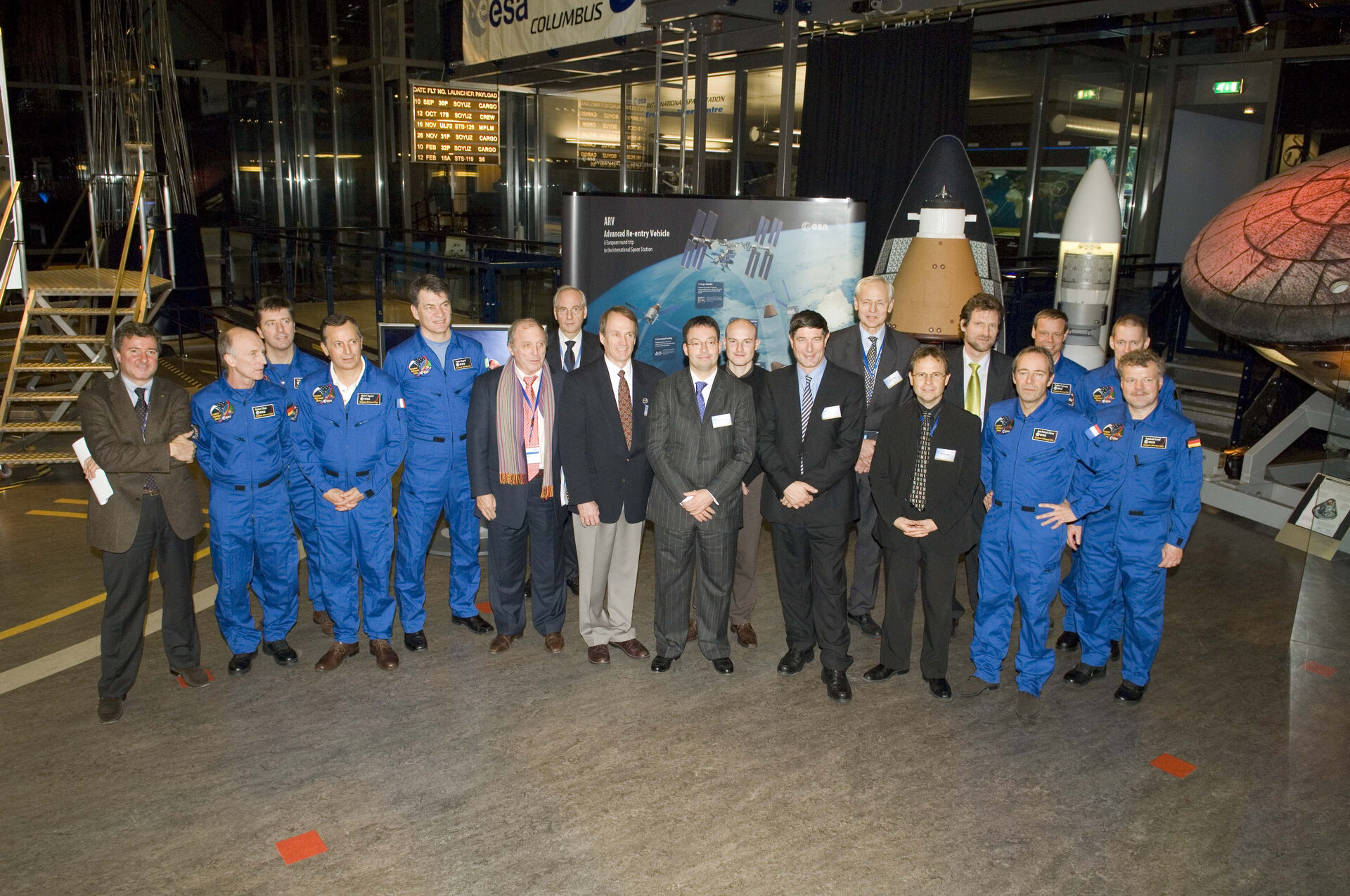 Members of the European Astronaut Corps and Ministerial Council delegates pose for a photo in ESTEC's Erasmus Centre