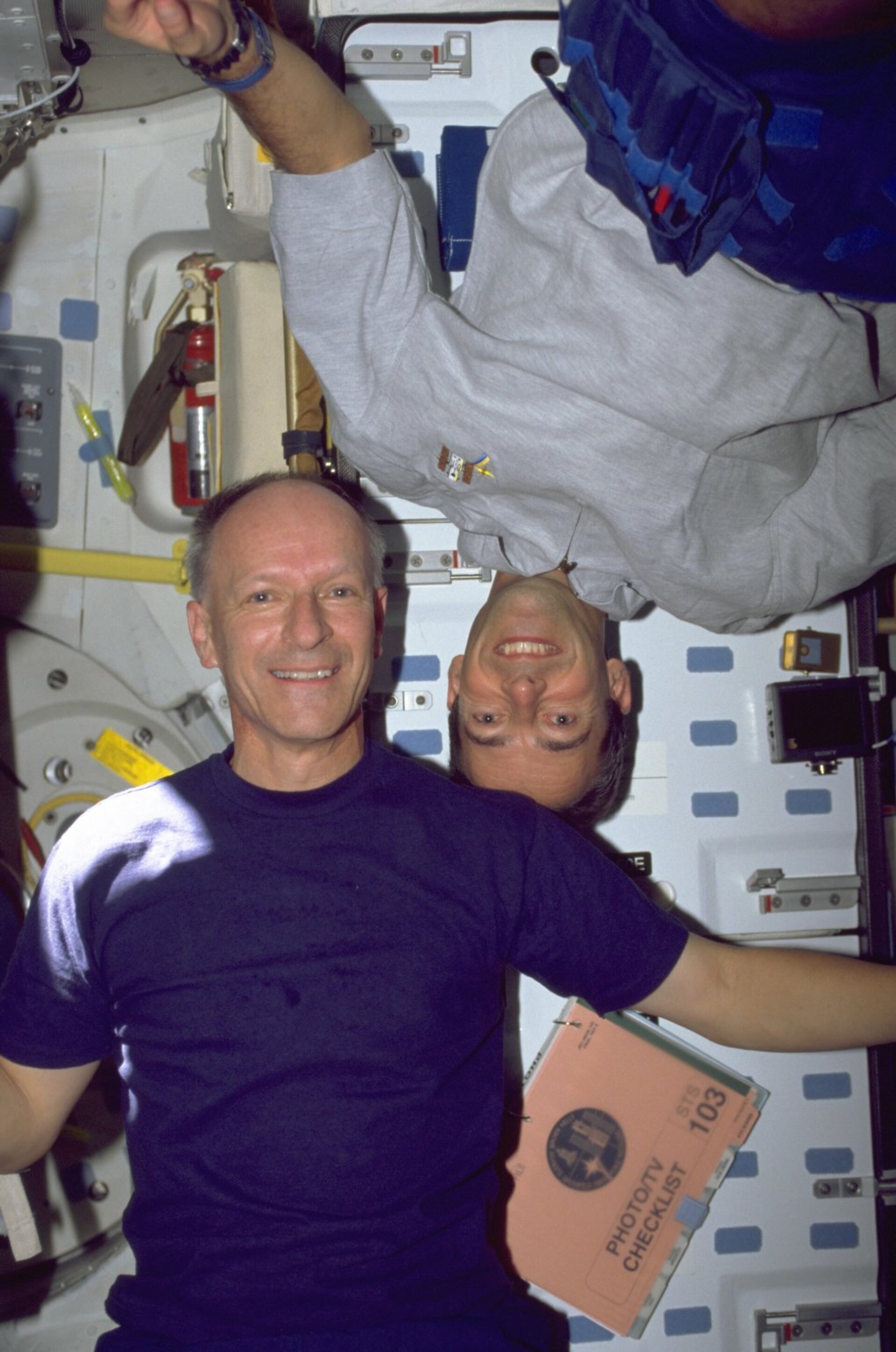 Claude Nicollier (left) and Jean-François Clervoy during the STS-103 mission