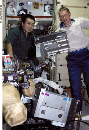 De Winne and Wakata work on the treadmill in Zvezda