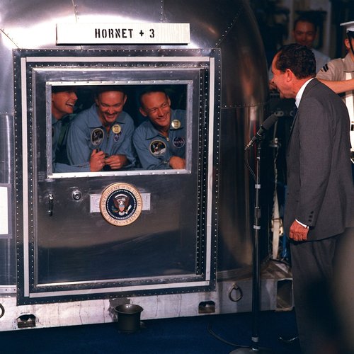 President Nixon greets the Apollo 11 crew after splashdown