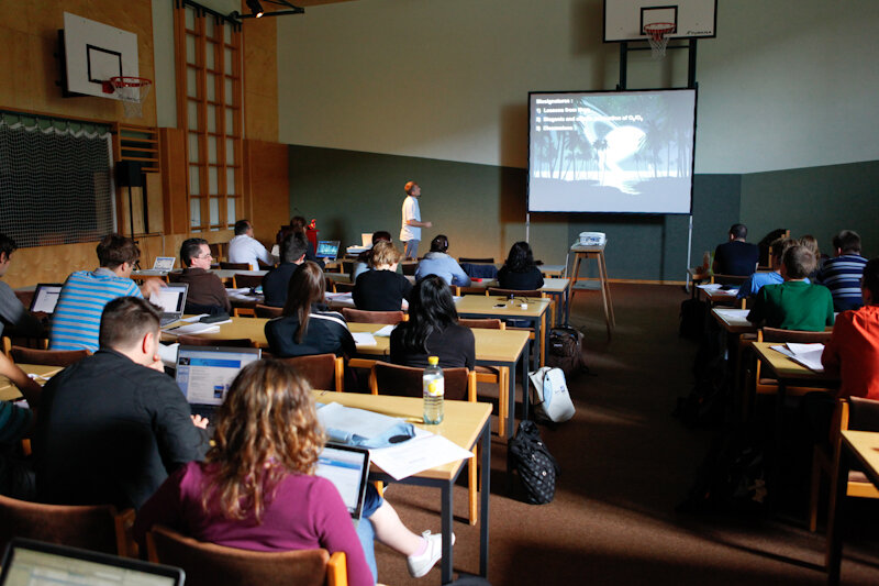 Students follow a presentation on biomarkers