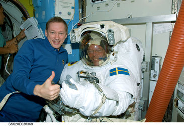 ESA astronauts Frank De Winne (left) and Christer Fuglesang inside the International Space Station's Quest Airlock