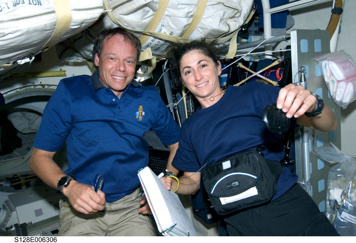 Fuglesang and Stott work on Shuttle middeck during STS-128