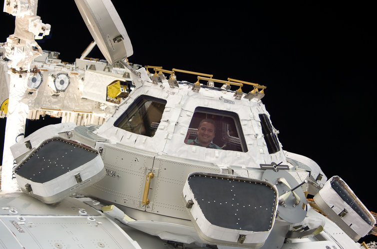 George Zamka is pictured in a window of the Cupola