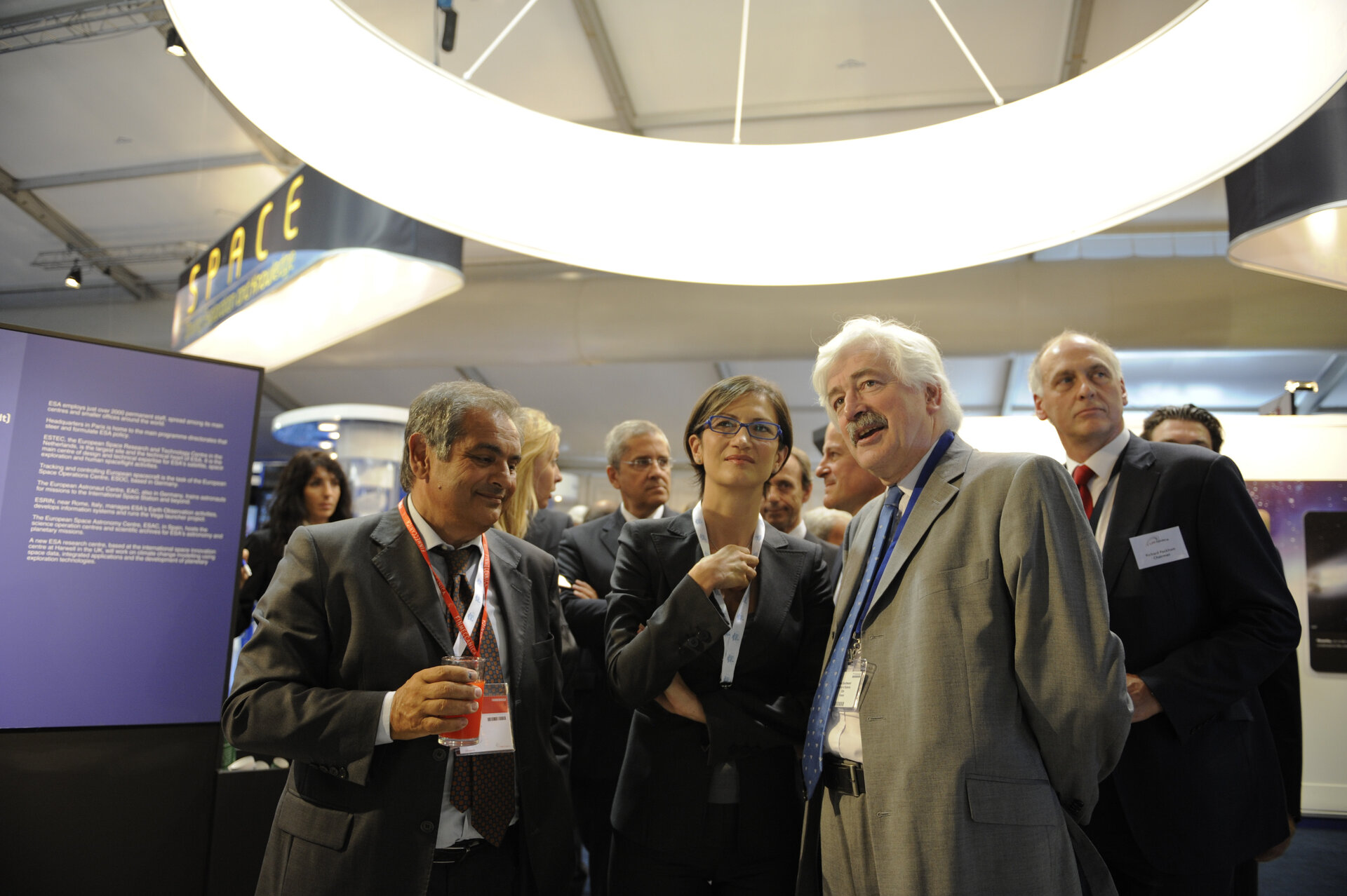 E. Saggese, M. Gelmini and D. Southwood visiting the ESA stand