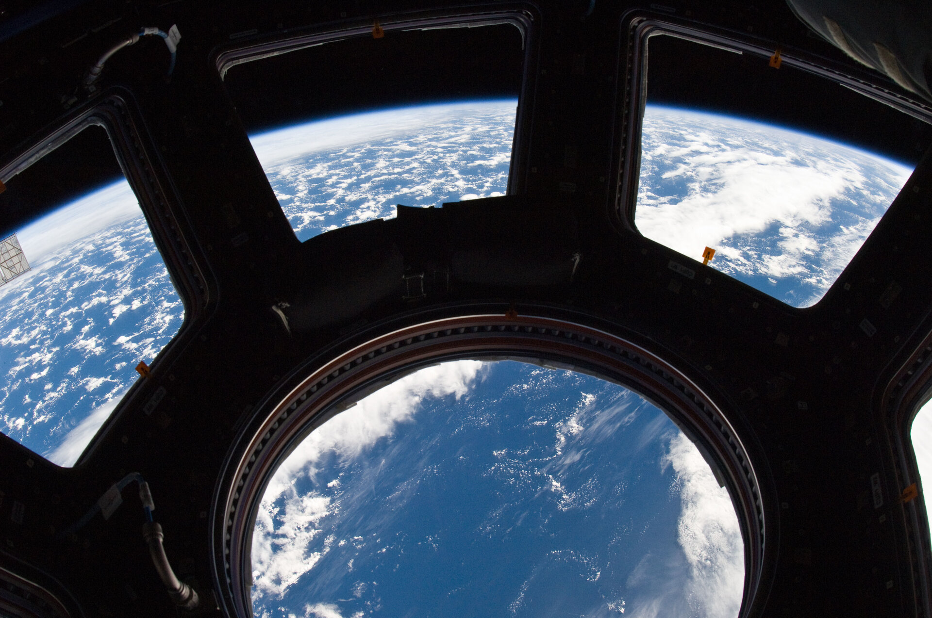 Earth and its horizon seen through the windows in Cupola
