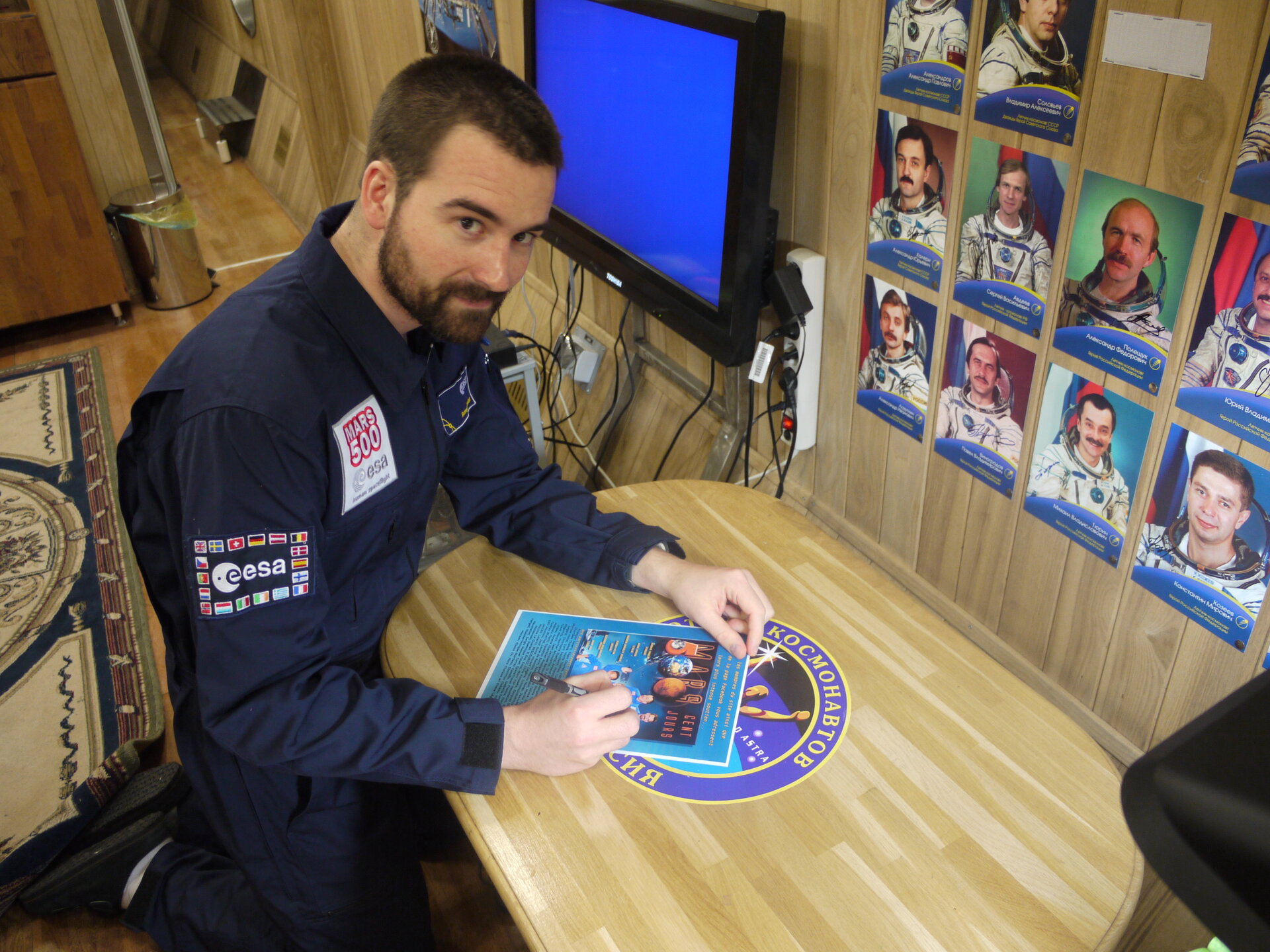 Romain Charles signing a greeting