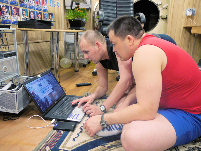 Sukhrob and Alexandr with computer