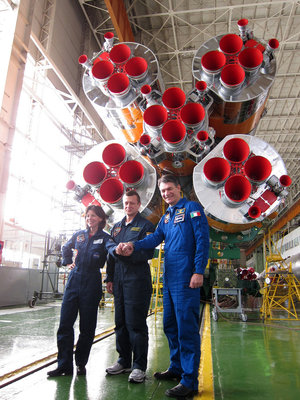 Coleman, Kondratyev and Nespoli with their Soyuz launcher