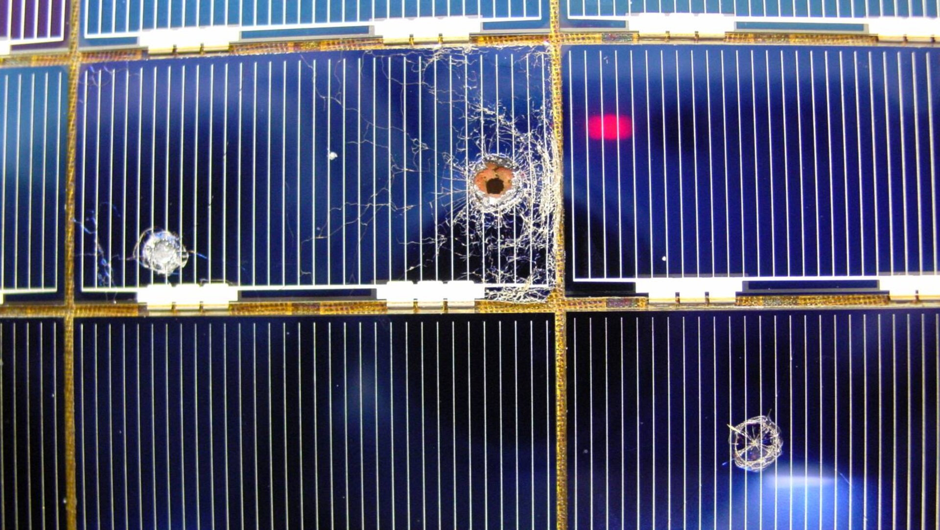 Impacts seen on returned solar arrays: averaging four holes per square metre