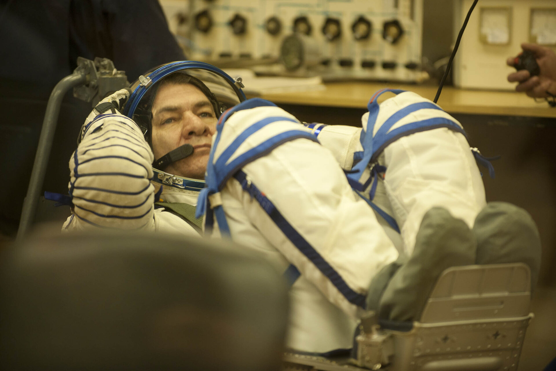 Paolo Nespoli dons his Sokol pressure suit in the MIK preparation building