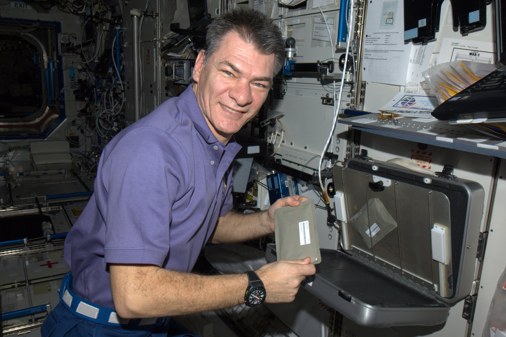 Paolo Nespoli shows a food warmer on ISS