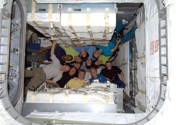 Crews of Expedition 26 and STS-133 inside Leonardo
