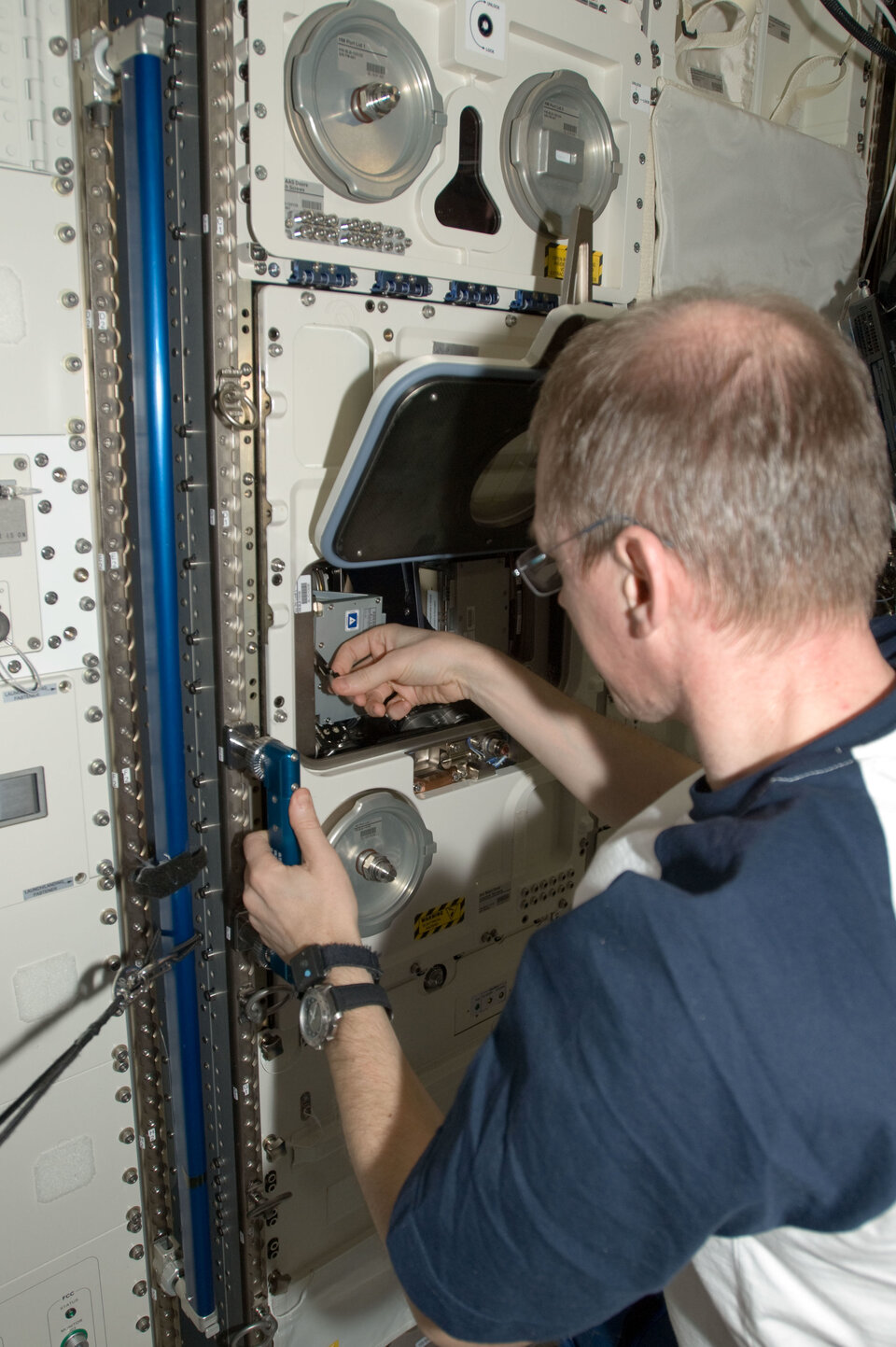 ESA astronaut Frank De Winne working with the Biolab facility in 2009