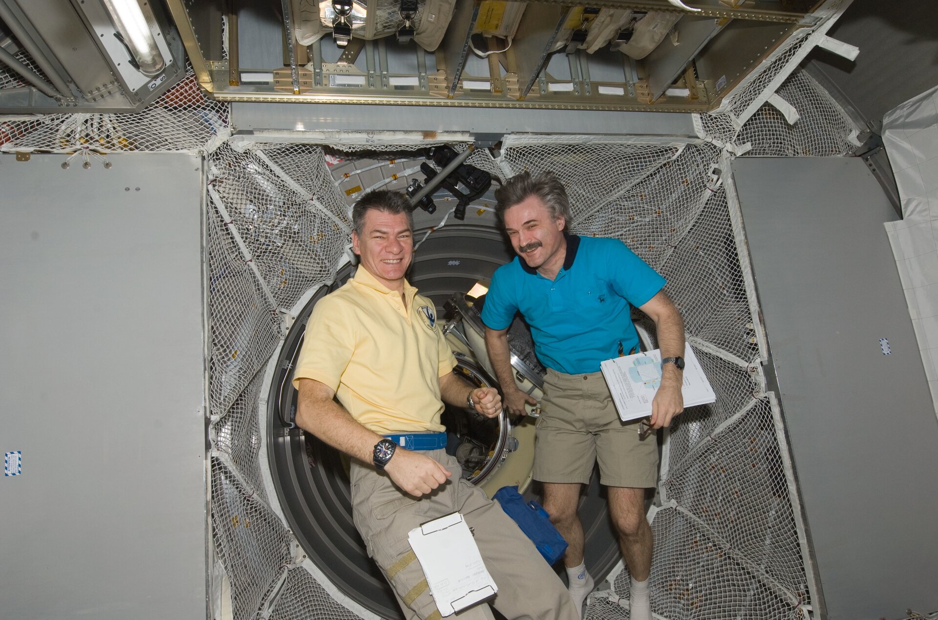 Paolo Nespoli and Alexander Kaleri working in ATV-2