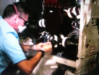 ESA astronaut Paolo Nespoli removes the failed valve