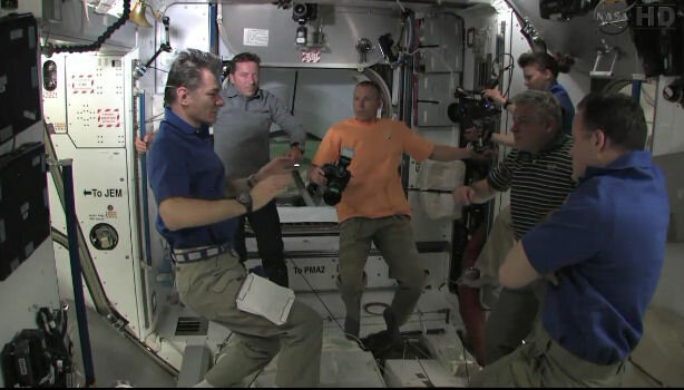 Paolo Nespoli giving a safety briefing to visitors