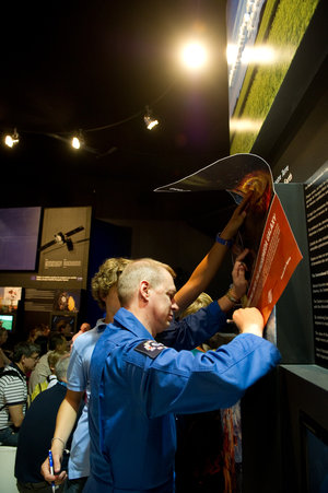 Franck De Winne signing posters at the ESA pavilion