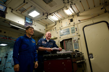 André Kuipers and Oleg Kononeko inside a Zarya module simulator