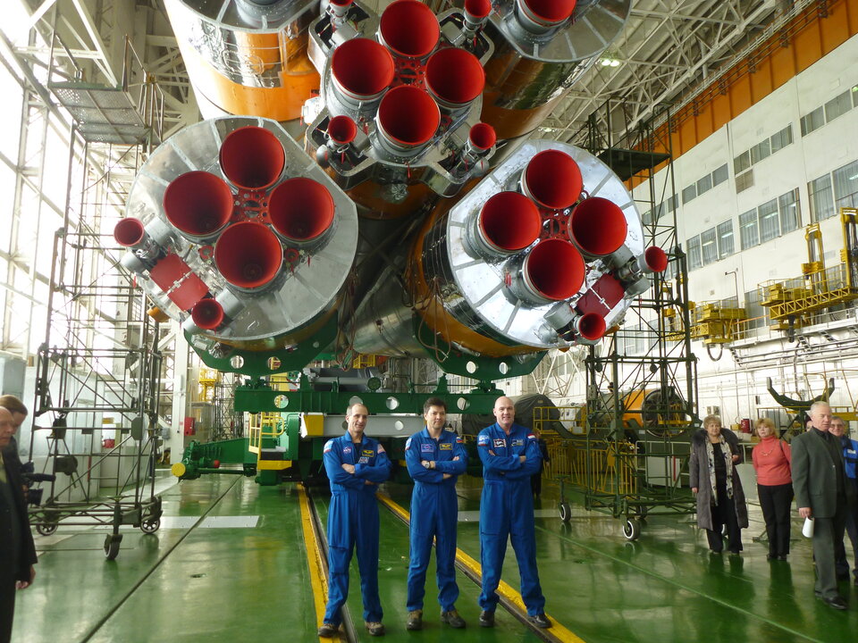 Soyuz TMA-03M crew posing with their launcher