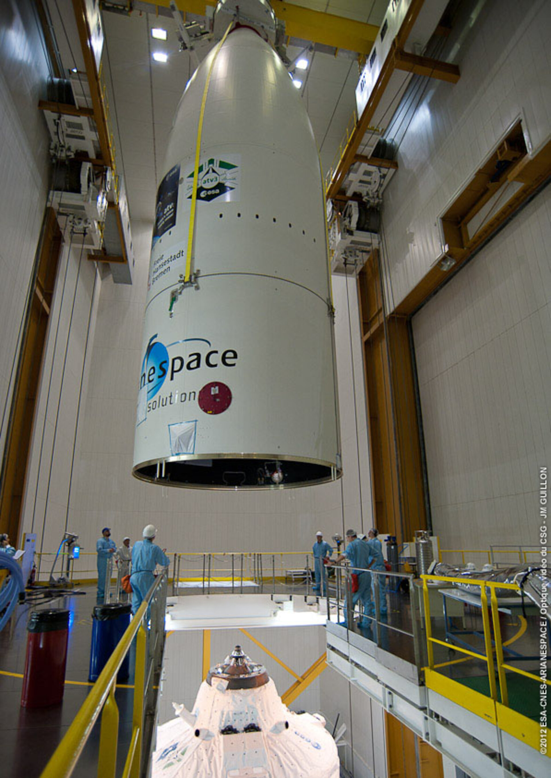 Giant Ariane 5 fairing suspended over top of ATV-3