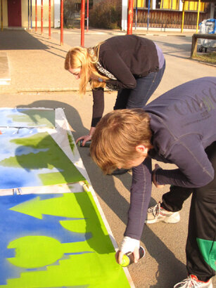 Students spray paint futuristic design