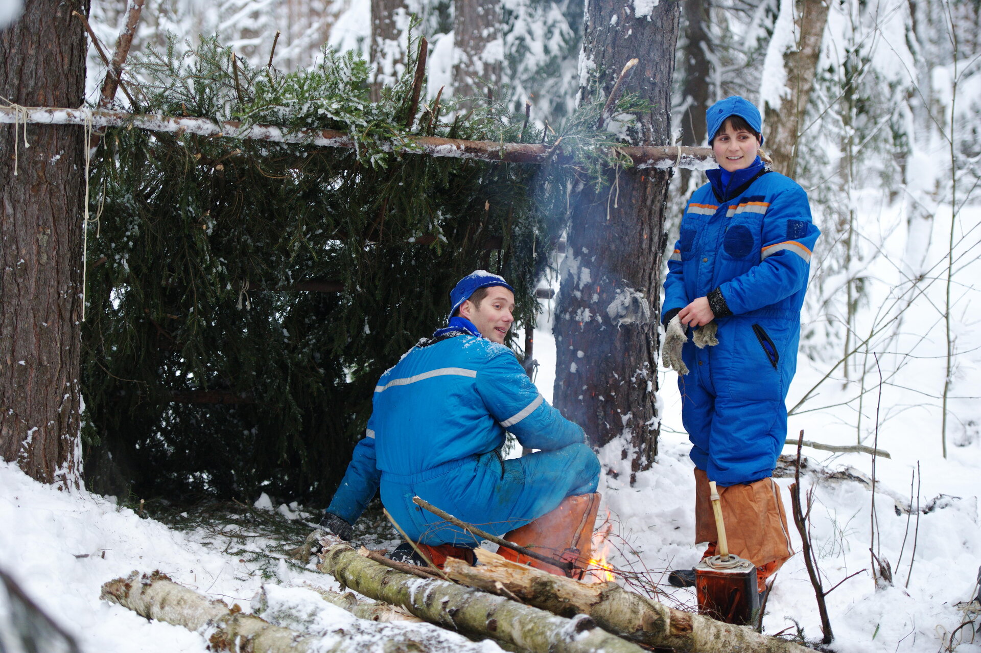 Thomas and Samantha building a shelter for survival training