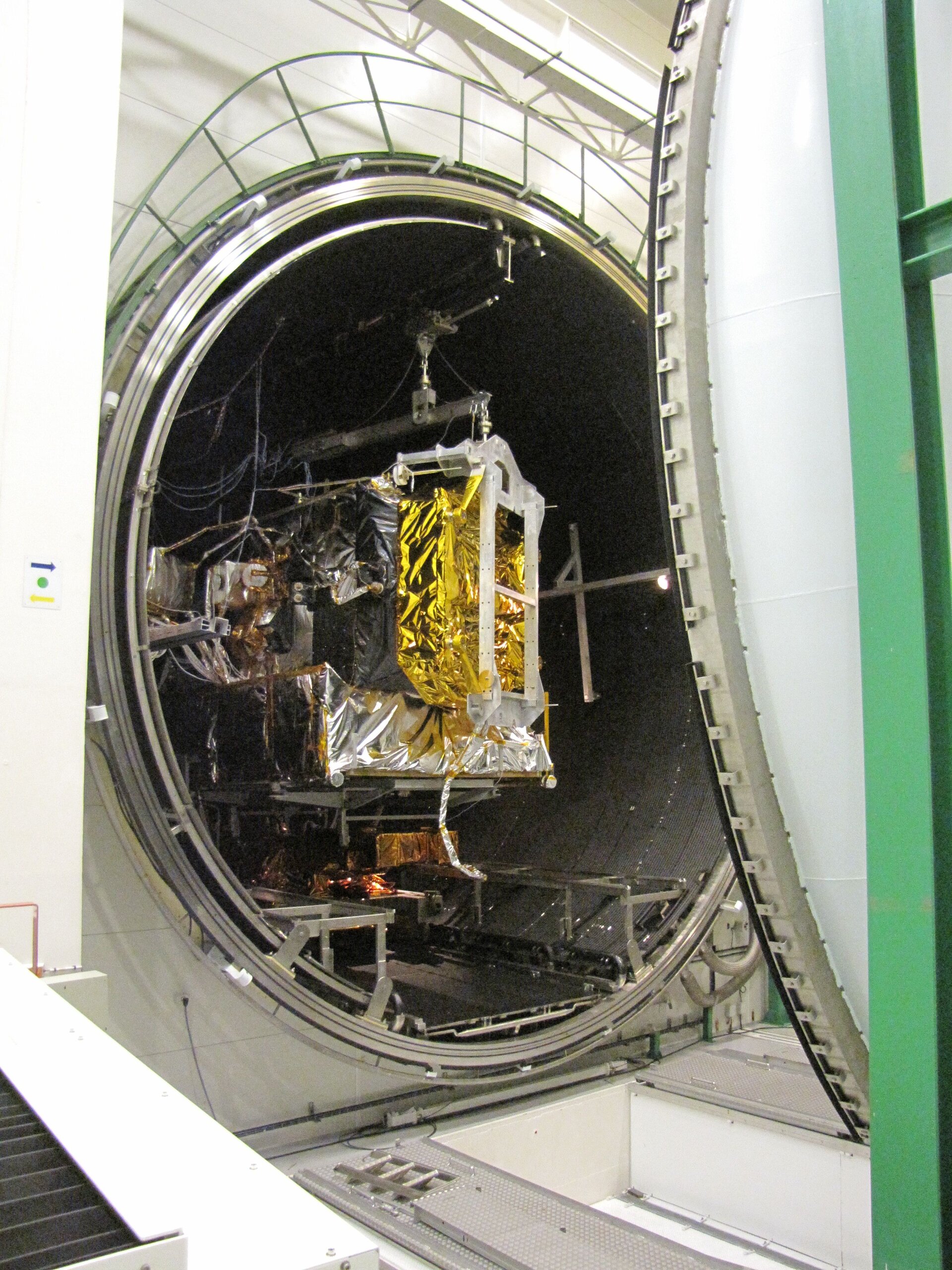 The vacuum chamber door closes