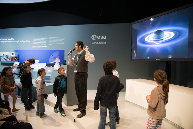 Public during a space quiz at ESA pavilion
