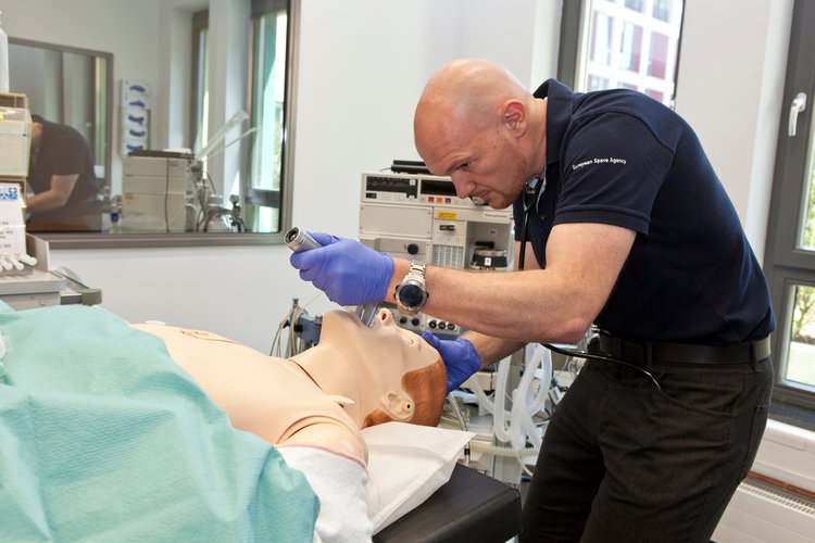 Alexander practising on a mannequin