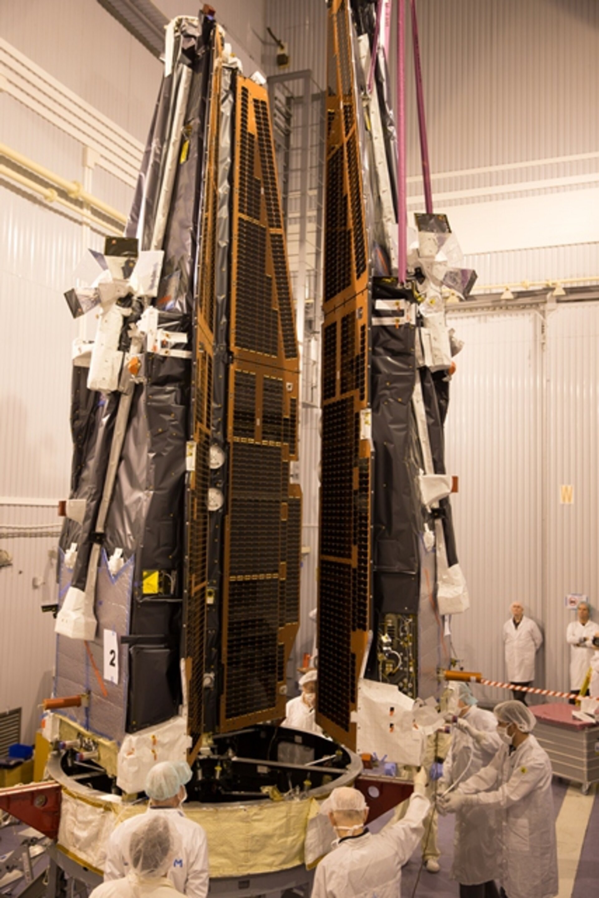 Three Swarm satellites on the launch adapter