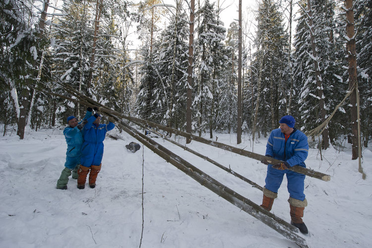 Building a shelter during winter survival training