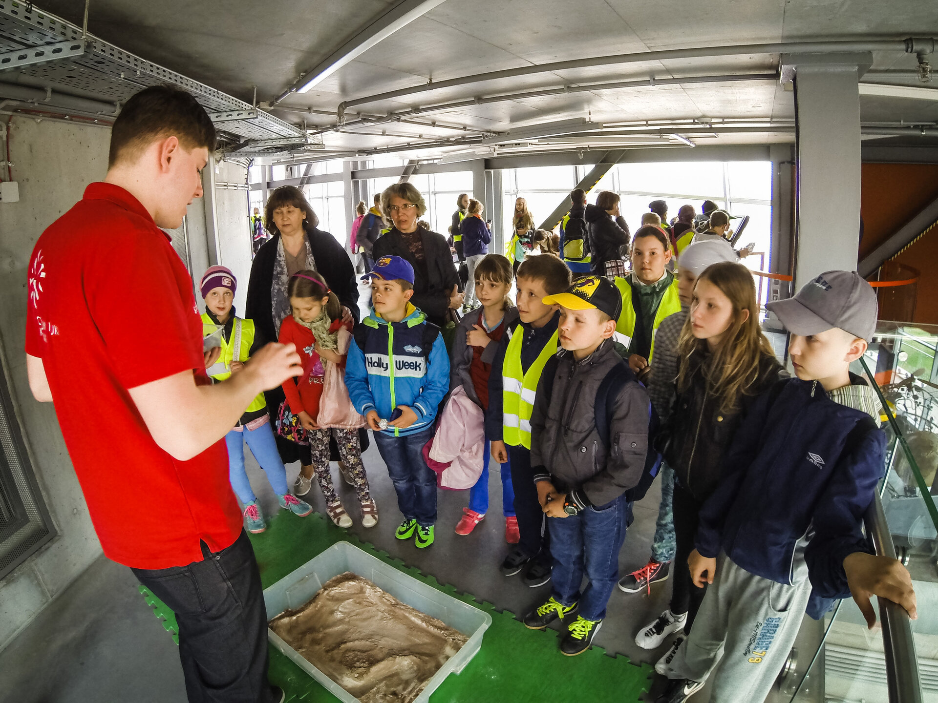 Students and teachers participating in a practical activity during the event