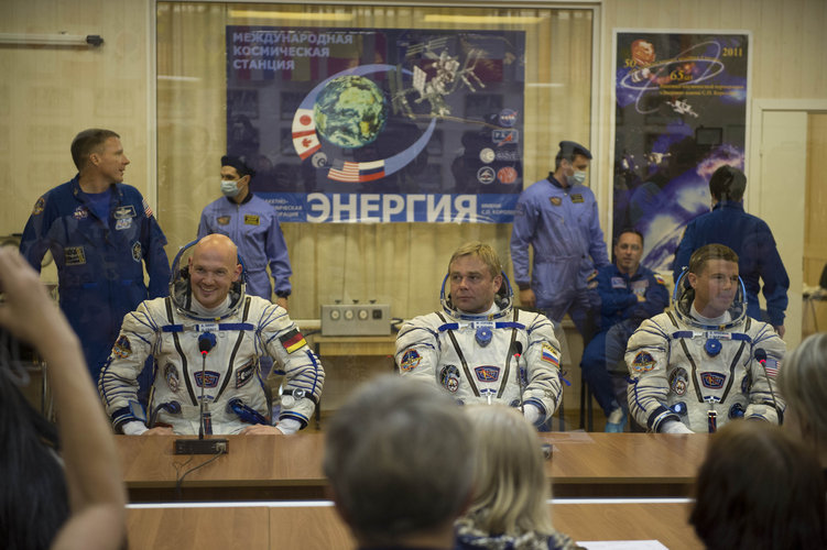 Expedition 40/41 crew members dressed in their Russian Sokol suits 