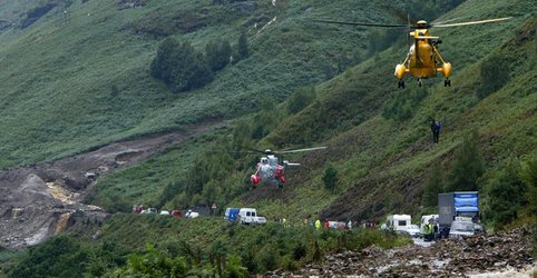 Two debris flows block vehicles along route