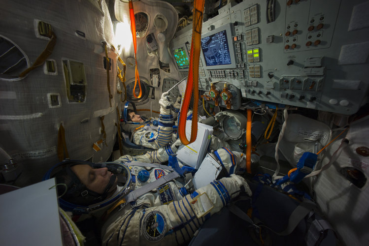 Samantha during training in the full-scale mockup of the Soyuz capsule