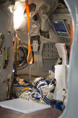 Samantha during training in the full-scale mockup of the Soyuz capsule