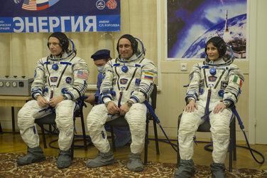 Expedition 42/43 crew members dressed in their Russian Sokol suit