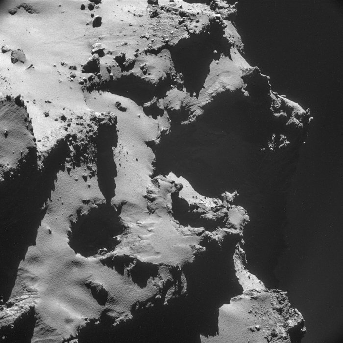 This image showcases one of the many pits seen on the surface of 67P/Churyumov–Gerasimenko.