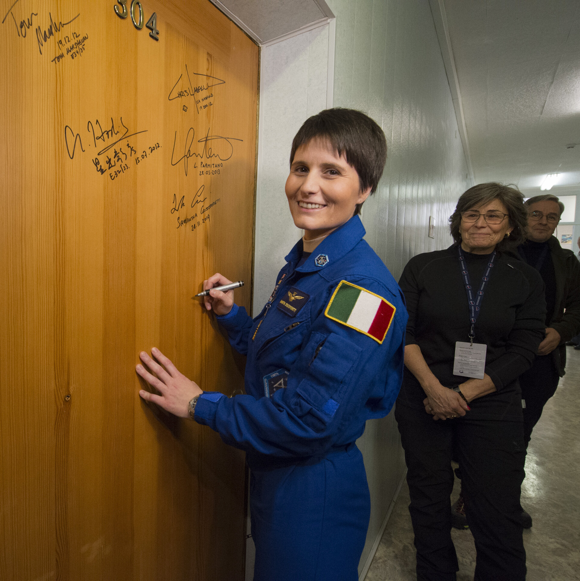Samantha Cristoforetti performs the traditional door signing