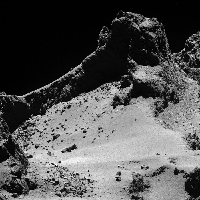 A section of the smaller of Comet 67P/Churyumov–Gerasimenko’s two lobes as seen through Rosetta’s narrow-angle camera from a distance of about 8 km to the surface on 14 October 2014. The resolution is 15 cm/pixel. The image is featured on the cover of 23 January 2014 issue of the journal Science.
