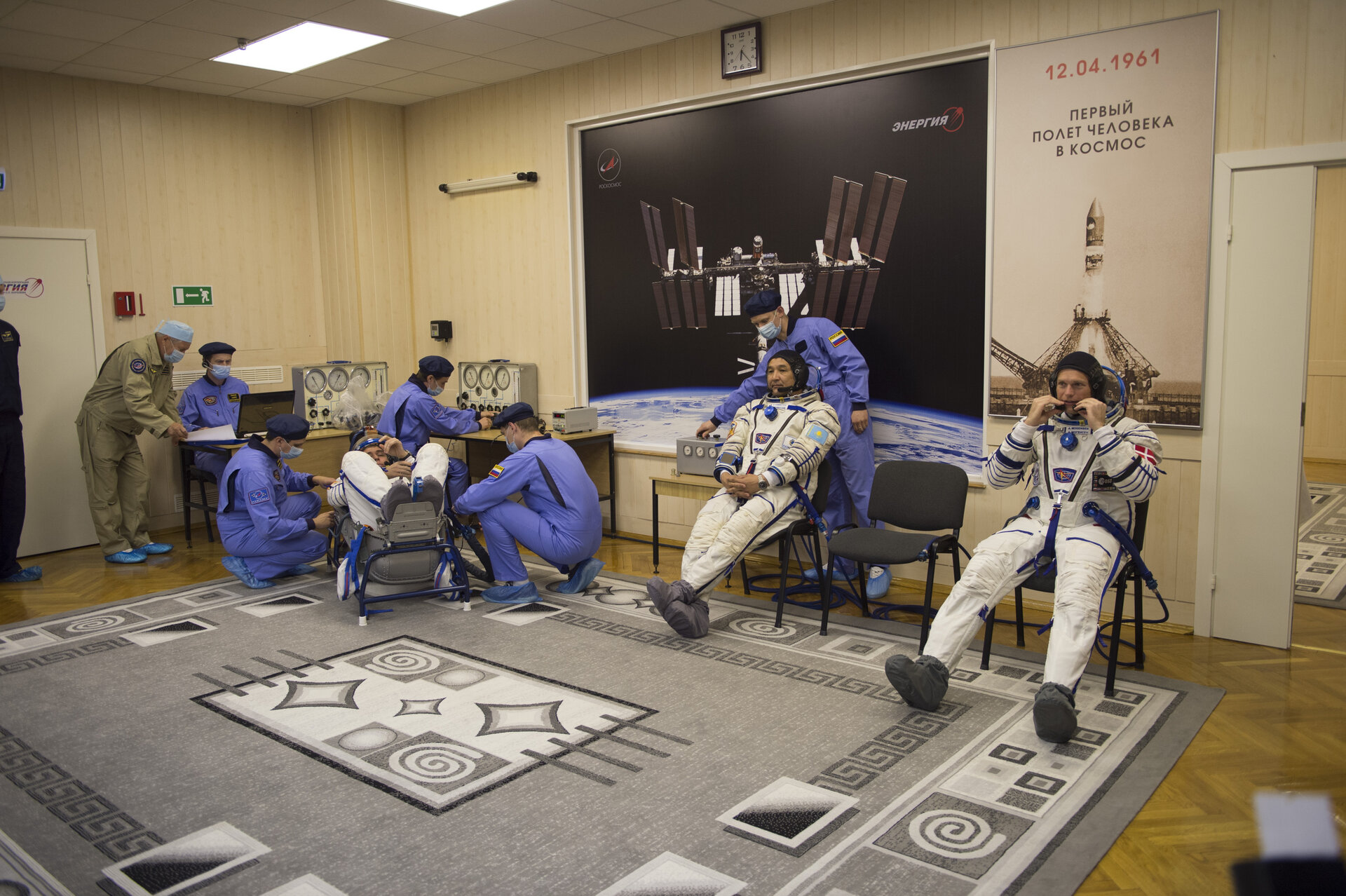 Soyuz TMA-18M crew members dressed in their Russian Sokol suit
