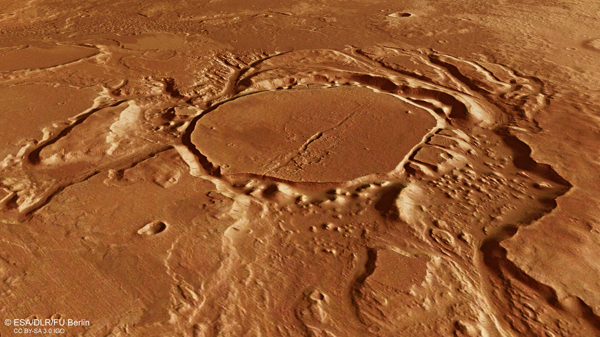 Perspective view of eroded crater in Mangala Valles