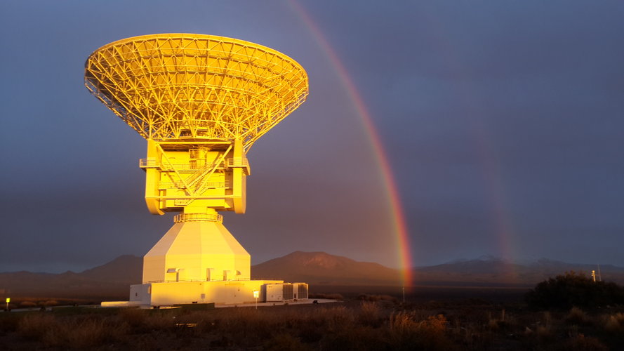 ESA’s Malargüe tracking station framed by a rainbow and highlighted by the Sun