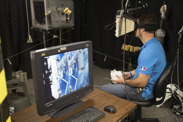 Thomas Pesquet using the Virtual Reality hardware 