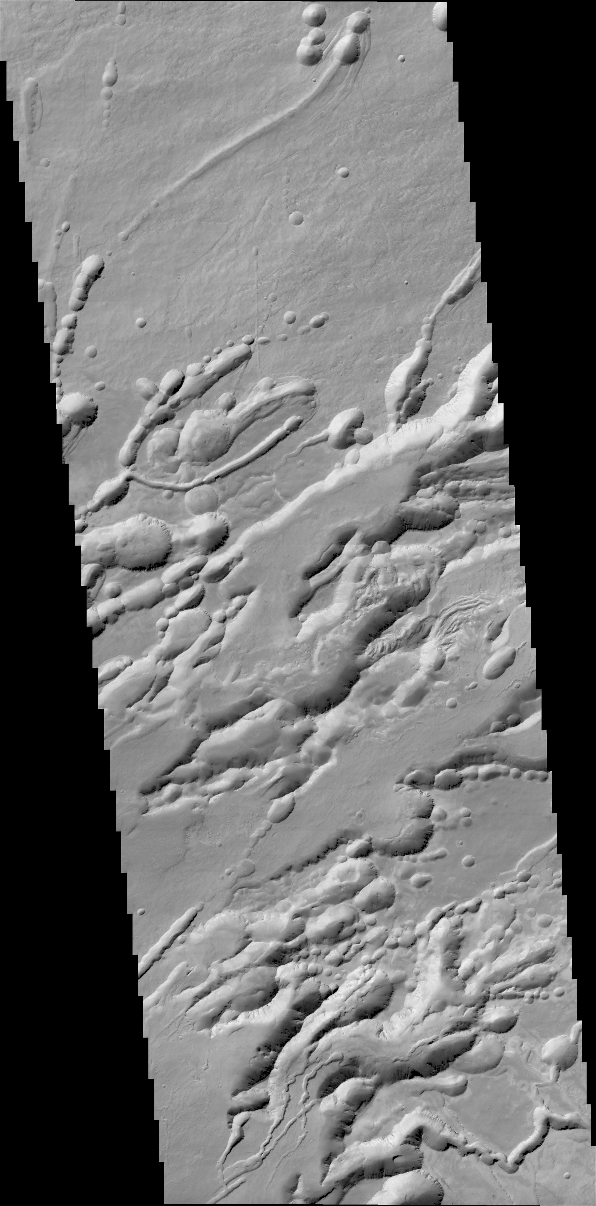 Dieser 25 km breite Bildstreifen der Zeilenkamera CASSiS zeigt Arsia Chasmata, eine Canonyonformation vulkanischen Ursprungs an der Flanke der Schildvulkans Arsia Mons, Quelle: ESA/Roscosmos/ExoMars/CaSSIS/UniBE