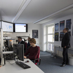 Analysts at work in the space debris facility located at ESA's ESOC mission control centre, Darmstadt, Germany.