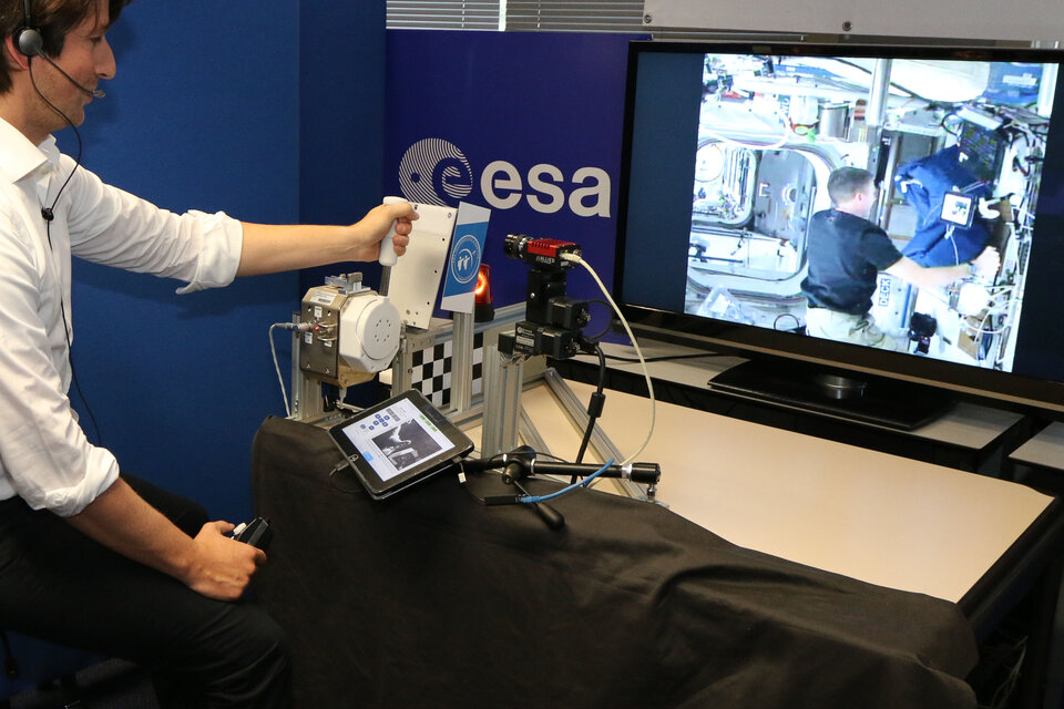 Haptics-2: NASA astronaut Terry Virts shaking hands with ESA PI André Schiele
