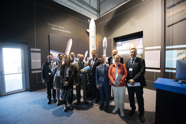 Isabelle Duvaux-Béchon shows AFD representatives the ESA Pavilion